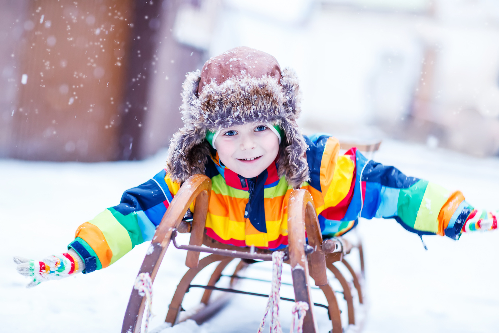 Cute Little Funny Boy In Colorful Winter Clothes Having Fun With