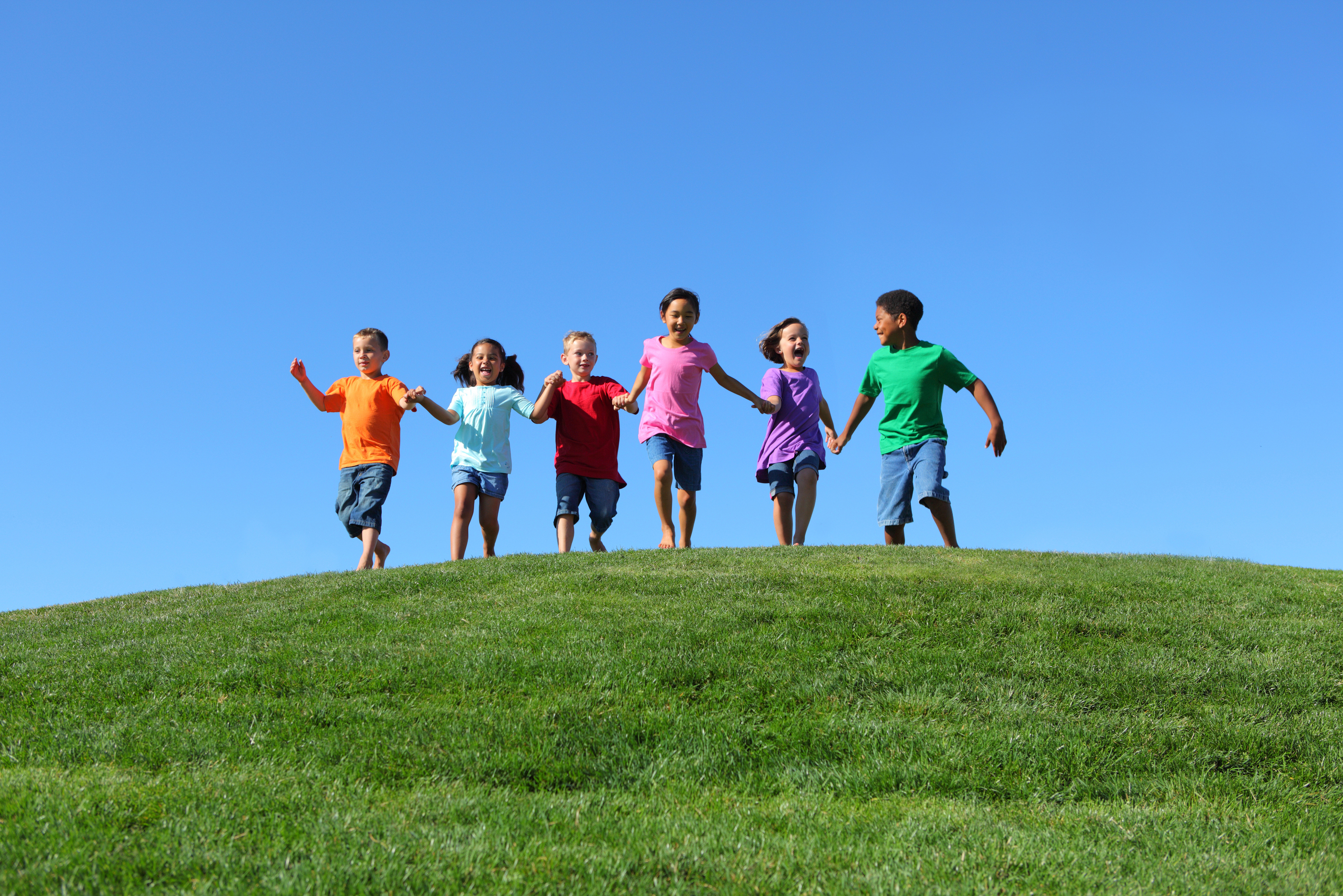 bigstock-Kids-running-on-grass-hill-wit-24830123